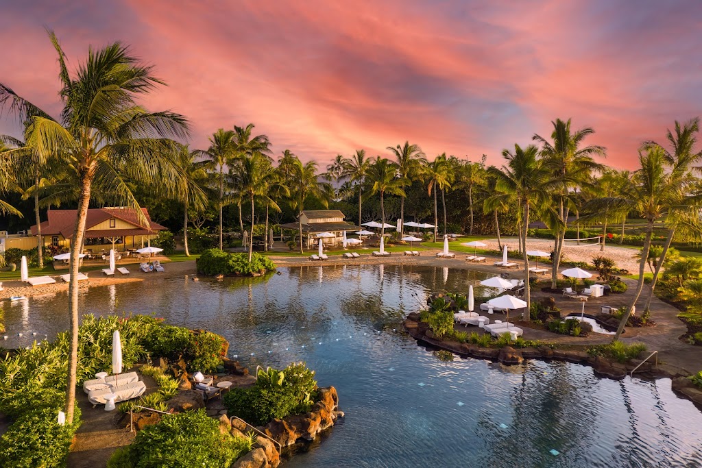 Panoramic view of a lush green golf course at The Club at Kukui`ula. Smooth