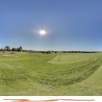 green grass with the flag in the hole.