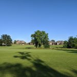 Panoramic view of a lush green golf course at The Club at Old Hawthorne. Smooth