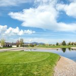 Panoramic view of a lush green golf course at The Club at Prairie Falls. Smooth