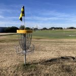 Panoramic view of a lush green golf course at The Club at Savannah Harbor. Smooth