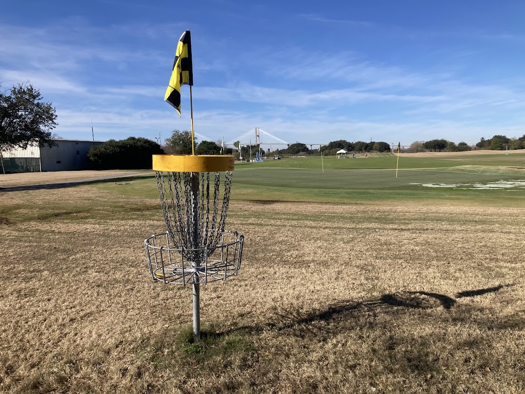 Panoramic view of a lush green golf course at The Club at Savannah Harbor. Smooth