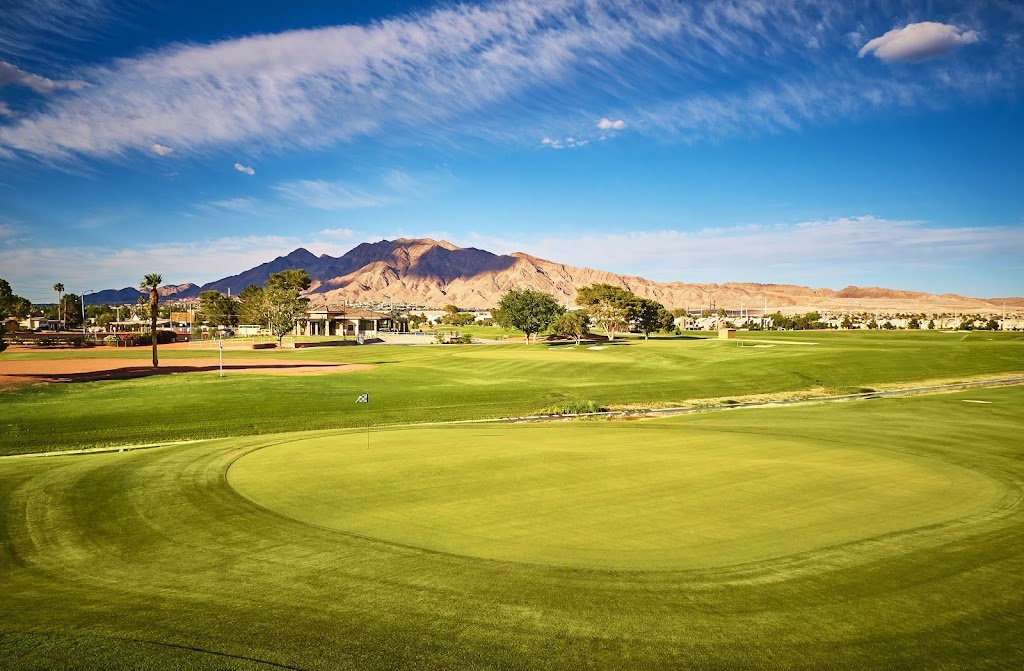 Panoramic view of a lush green golf course at The Club at Sunrise. Smooth