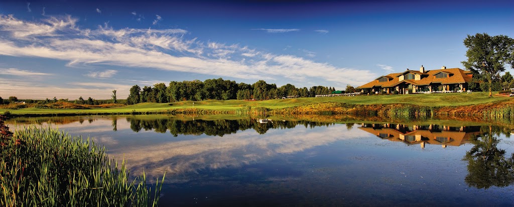 Panoramic view of a lush green golf course at The Clubhouse at Grand Traverse Resort and Spa. Smooth