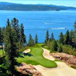 Panoramic view of a lush green golf course at The Coeur d'Alene Resort Golf Course. Smooth