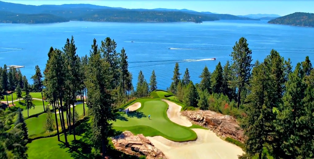 Panoramic view of a lush green golf course at The Coeur d'Alene Resort Golf Course. Smooth