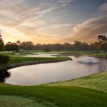 Panoramic view of a lush green golf course at The Country Club of Darien. Smooth