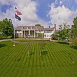 Panoramic view of a lush green golf course at The Country Club of Scranton. Smooth