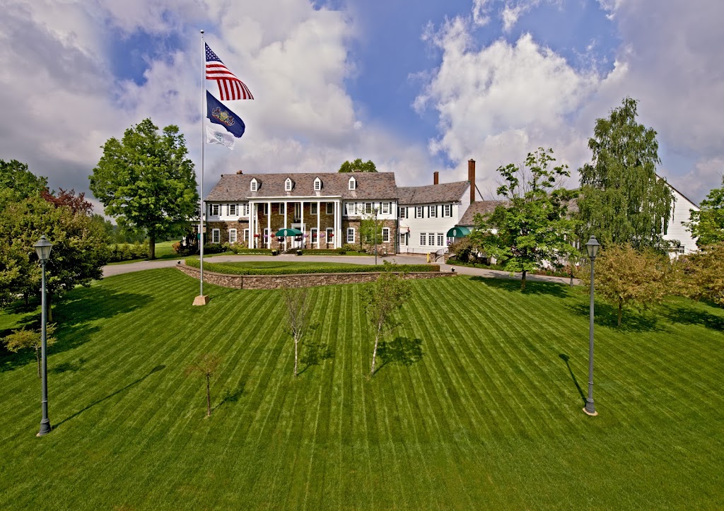 Panoramic view of a lush green golf course at The Country Club of Scranton. Smooth