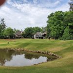 Panoramic view of a lush green golf course at The Country Club of the South. Smooth