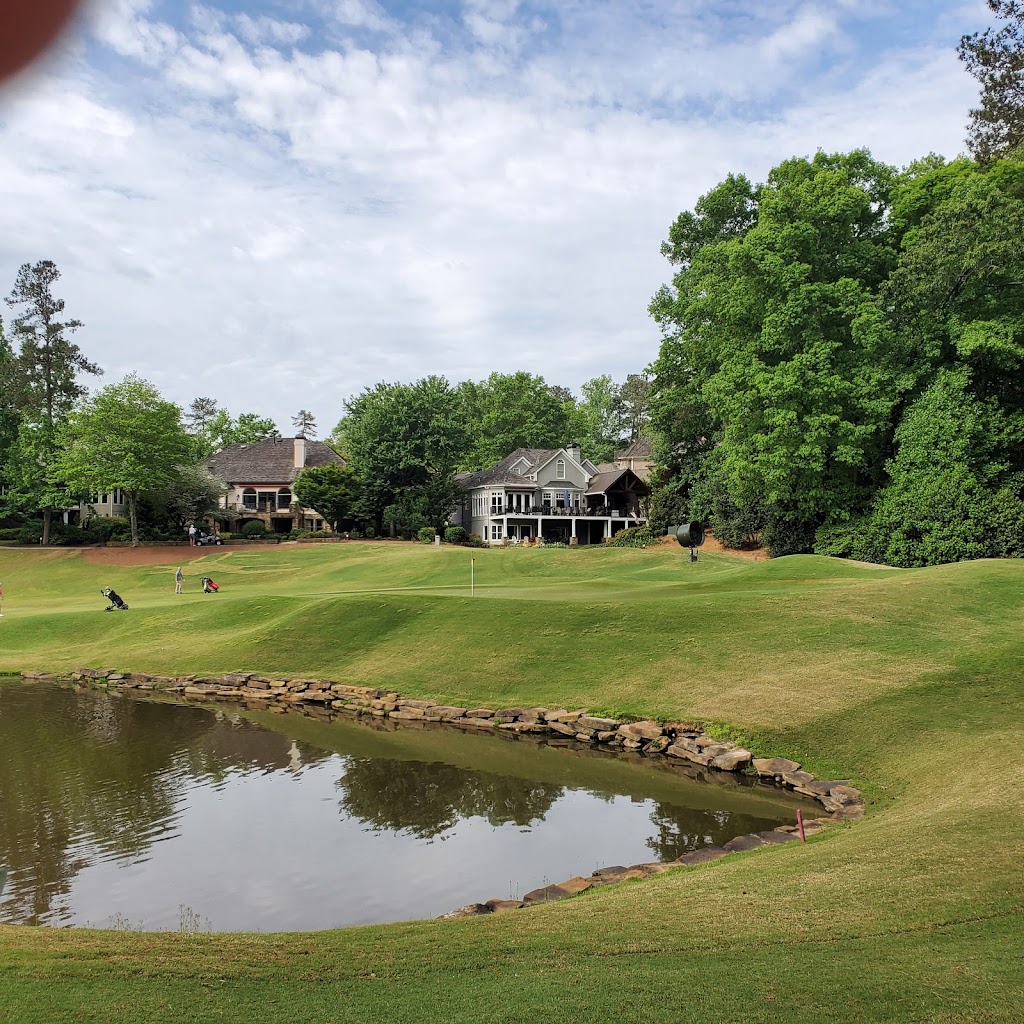 Panoramic view of a lush green golf course at The Country Club of the South. Smooth