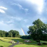 Panoramic view of a lush green golf course at The Farms Country Club. Smooth