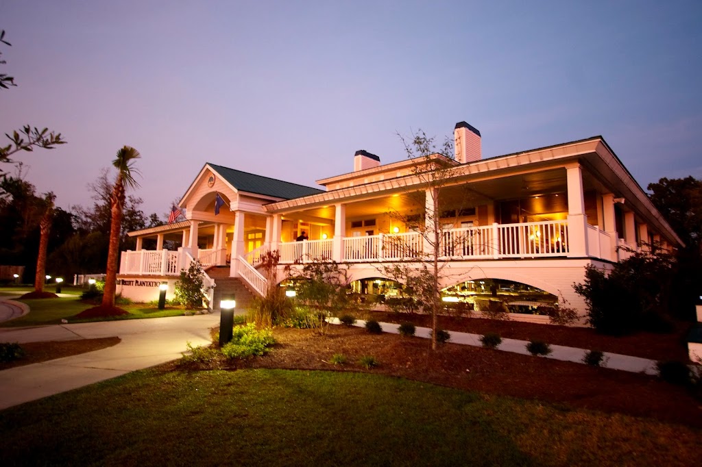 Panoramic view of a lush green golf course at The Golf Club At Wescott Plantation. Smooth