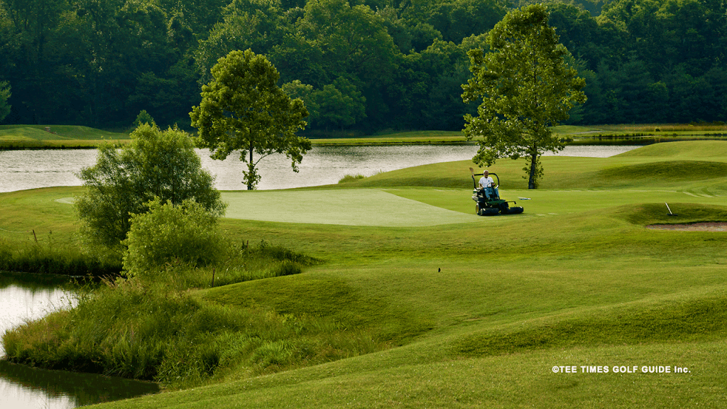 Panoramic view of a lush green golf course at The Golf Club at Deer Chase. Smooth