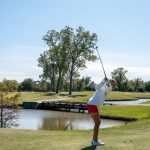 Panoramic view of a lush green golf course at The Golf Club at StoneBridge. Smooth