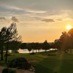 Panoramic view of a lush green golf course at The Greens Country Club. Smooth