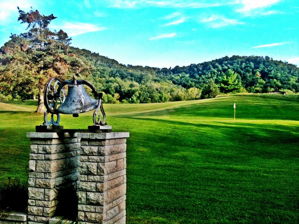 Panoramic view of a lush green golf course at The Grove Golf Course. Smooth