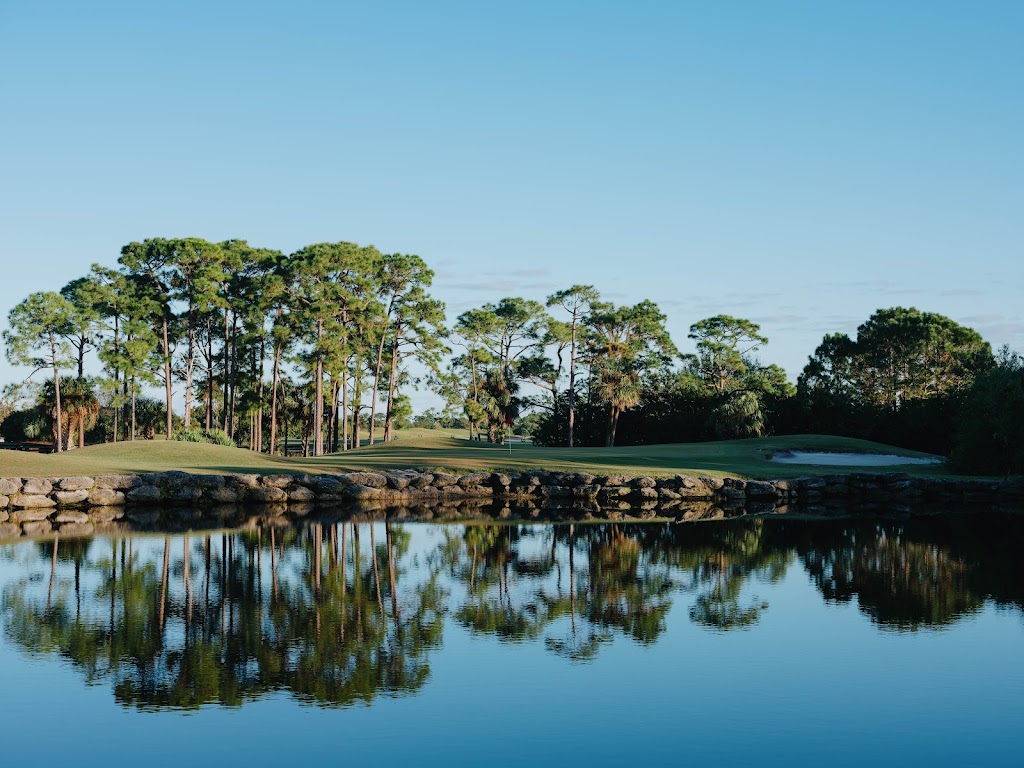 Panoramic view of a lush green golf course at The Habitat Golf Course. Smooth