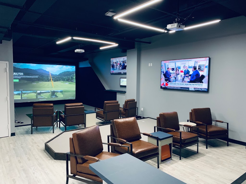 Panoramic view of a lush green golf course at The Hack Shack. Smooth