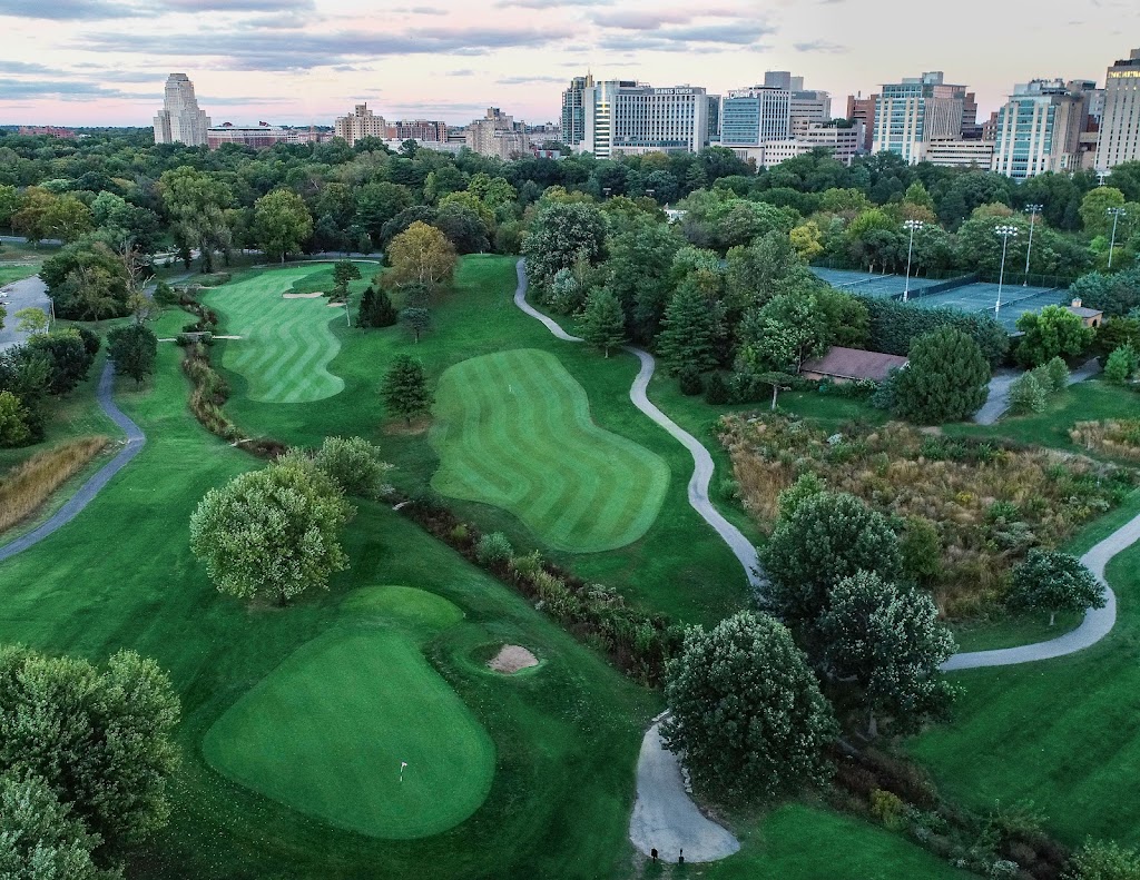 Panoramic view of a lush green golf course at The Highlands Golf & Tennis. Smooth