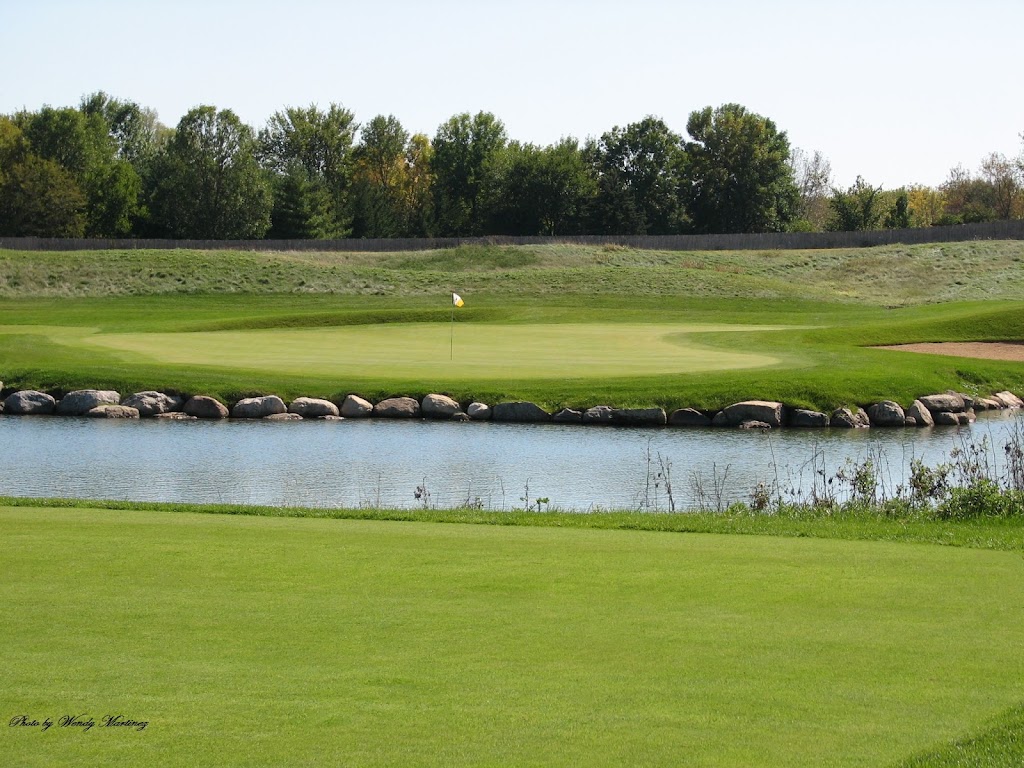 Panoramic view of a lush green golf course at The Highlands of Elgin Golf Course. Smooth