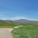 Panoramic view of a lush green golf course at The Homestead Golf Course. Smooth