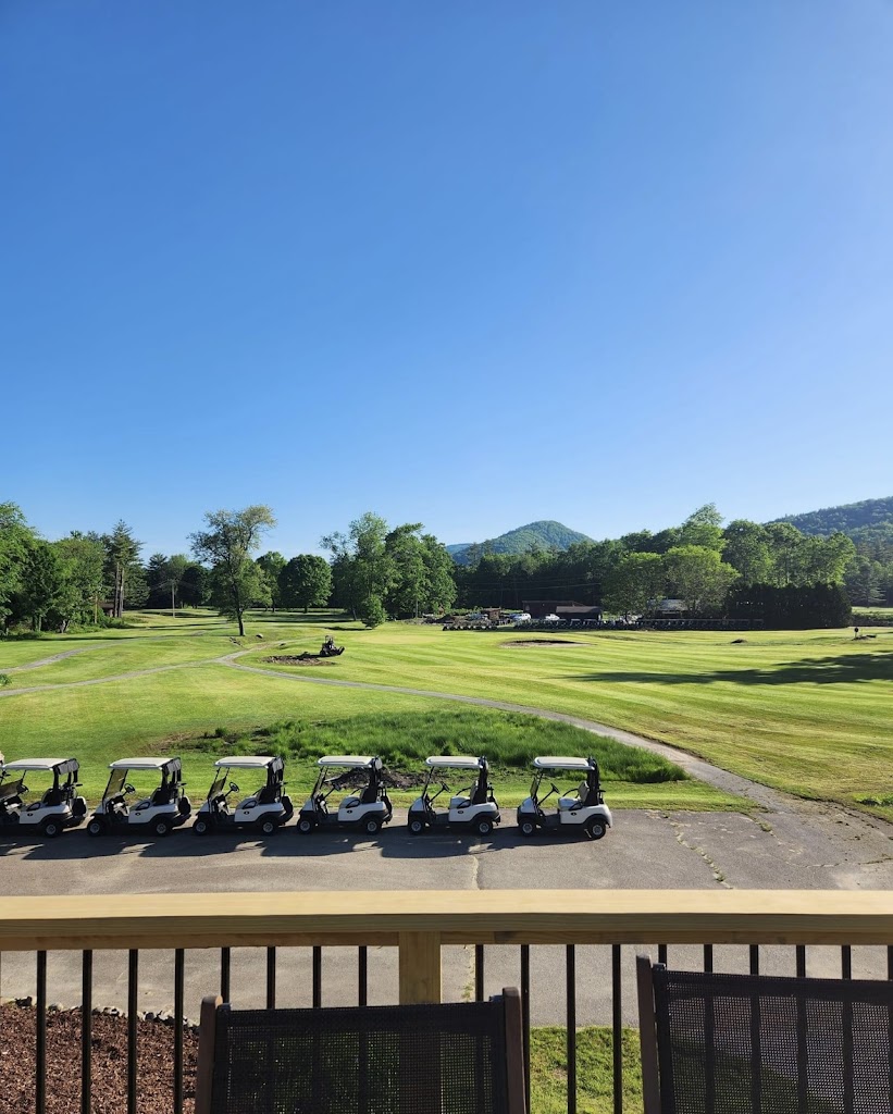 Panoramic view of a lush green golf course at The Jack Golf Course. Smooth