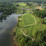 Panoramic view of a lush green golf course at The Landing Course at Reynolds Lake Oconee. Smooth