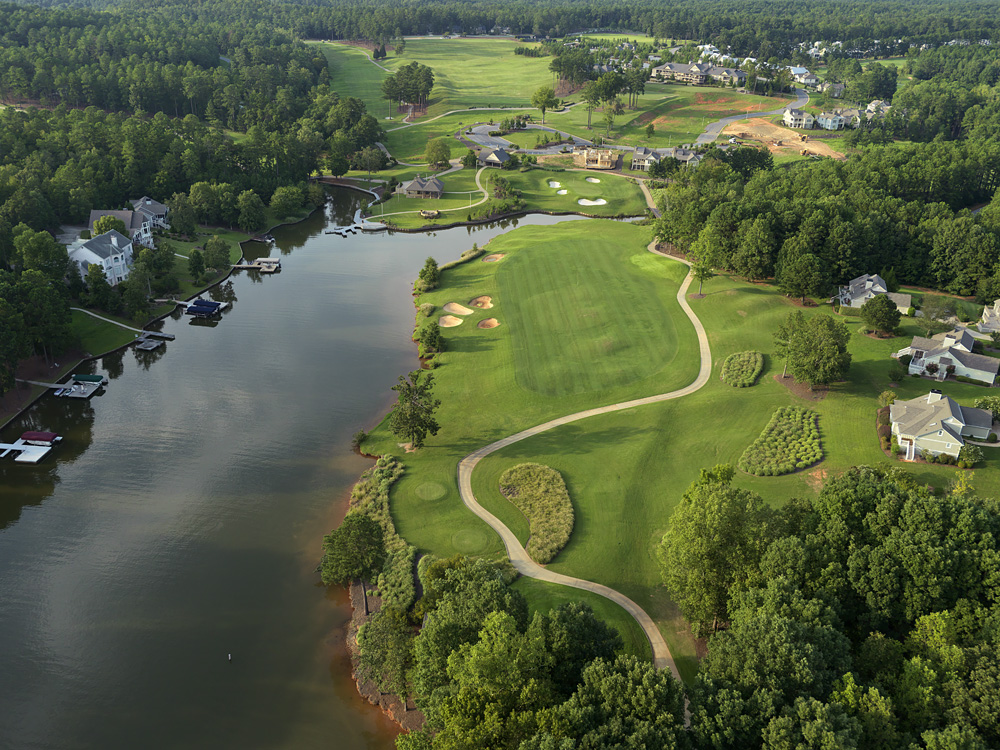 Panoramic view of a lush green golf course at The Landing Course at Reynolds Lake Oconee. Smooth