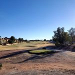 Panoramic view of a lush green golf course at The Legacy Golf Club. Smooth