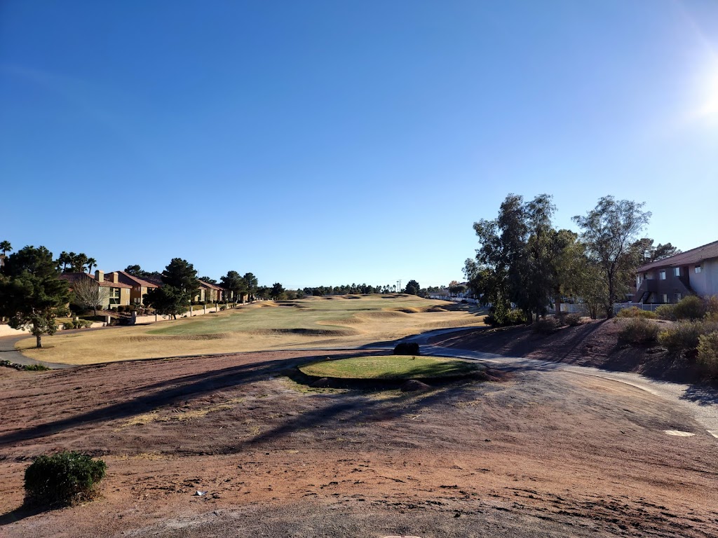 Panoramic view of a lush green golf course at The Legacy Golf Club. Smooth