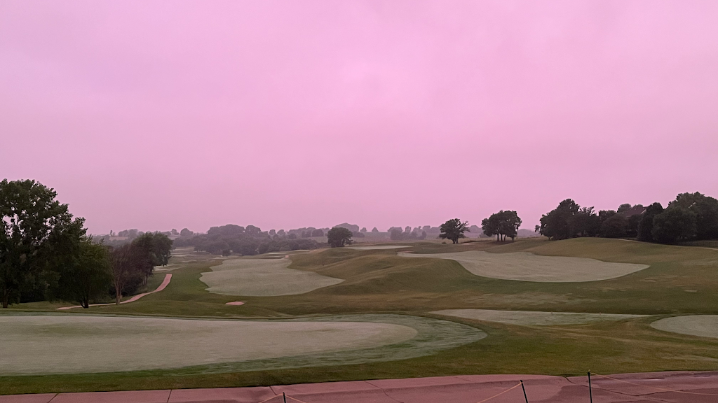 Panoramic view of a lush green golf course at The Legacy Golf Club. Smooth