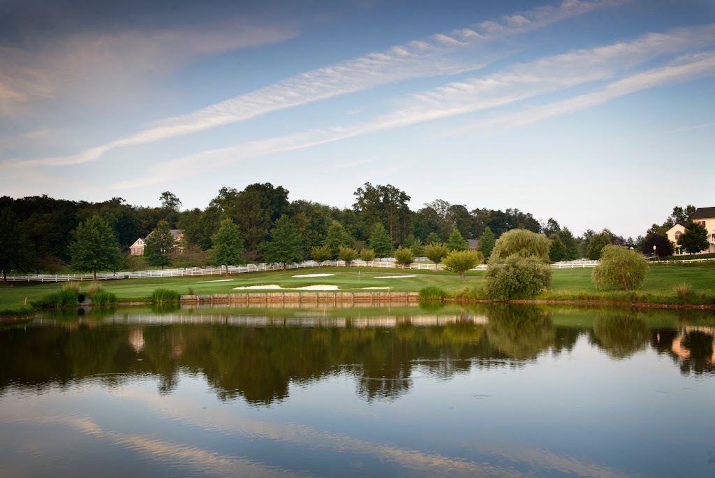 Panoramic view of a lush green golf course at The Links at Challedon. Smooth