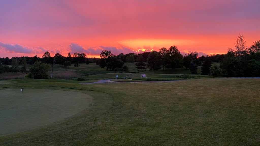 Panoramic view of a lush green golf course at The Links at Lang Farm. Smooth