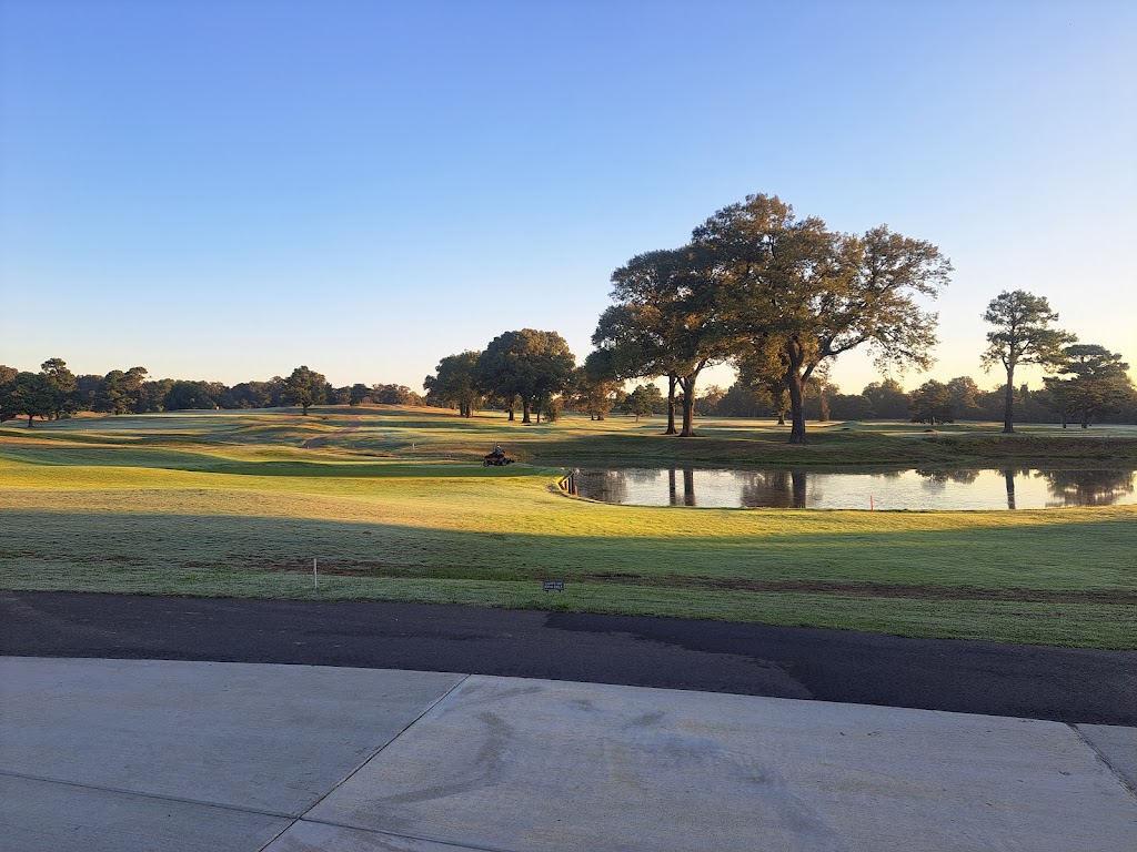 Panoramic view of a lush green golf course at The Links at Pine Hill. Smooth