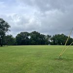 Panoramic view of a lush green golf course at The Links at Riverside. Smooth