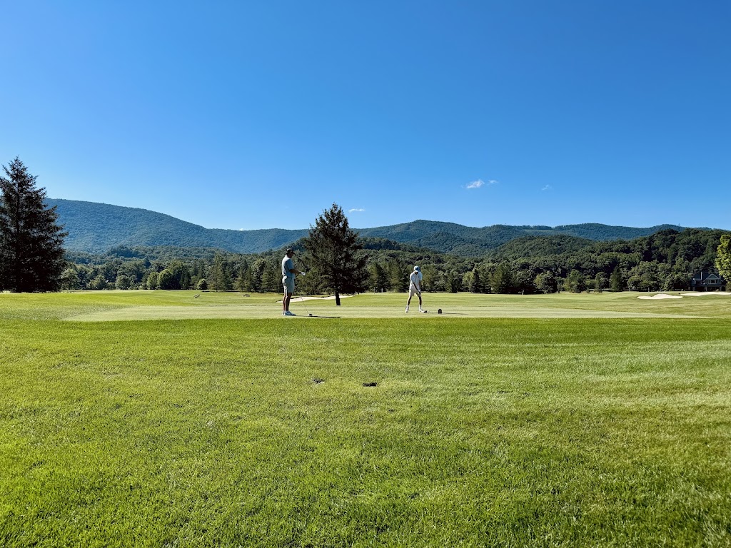 Panoramic view of a lush green golf course at The Lodge at The Greenbrier Sporting Club. Smooth