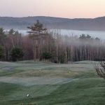 Panoramic view of a lush green golf course at The Meadows Golf Club. Smooth