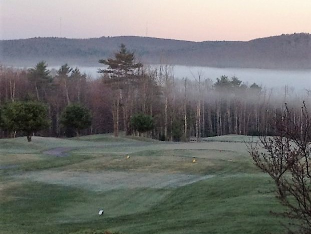 Panoramic view of a lush green golf course at The Meadows Golf Club. Smooth