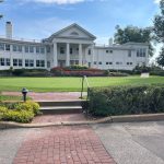 Panoramic view of a lush green golf course at The Minikahda Club. Smooth