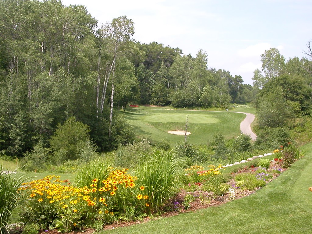 Panoramic view of a lush green golf course at The Patriot Golf Course. Smooth