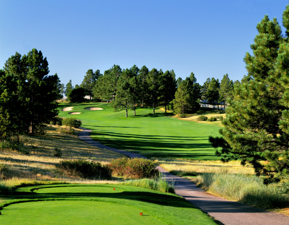 Panoramic view of a lush green golf course at The Pinery Country Club. Smooth