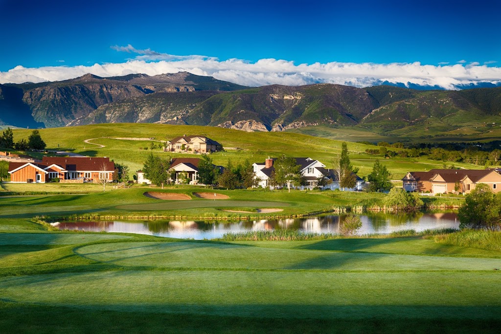 Panoramic view of a lush green golf course at The Powder Horn Golf Club. Smooth