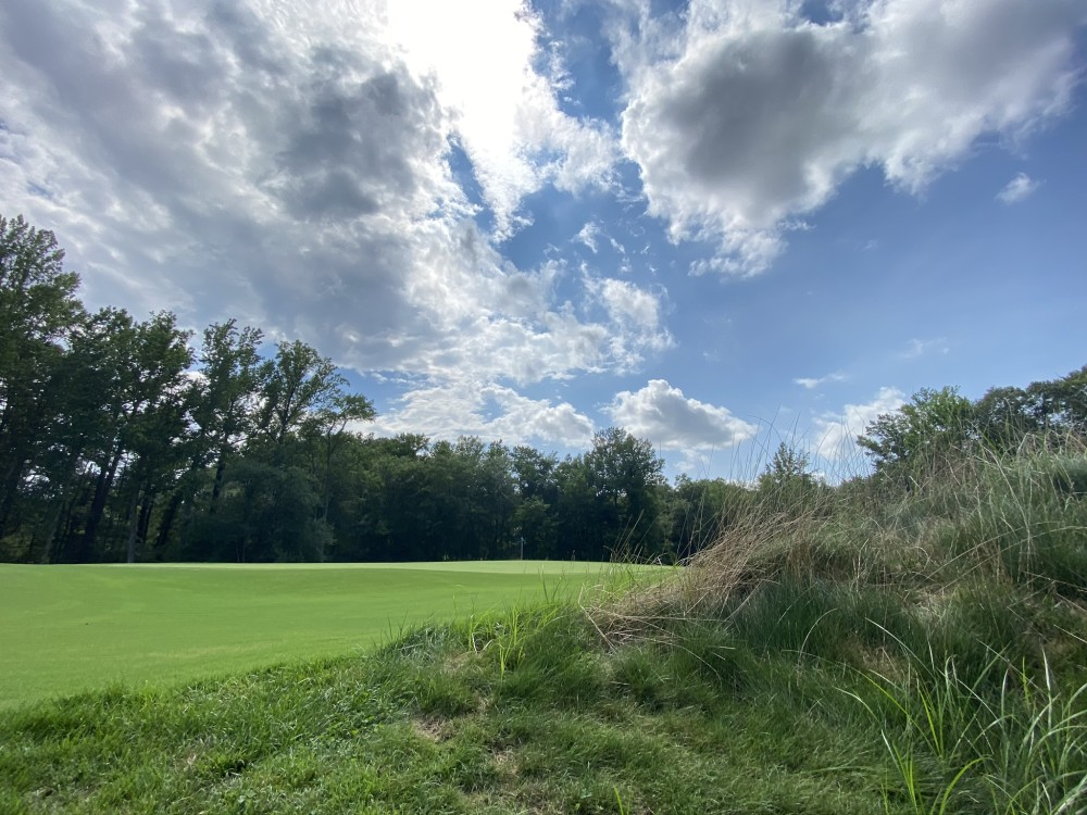 Panoramic view of a lush green golf course at The Preserve at Eisenhower. Smooth