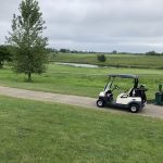 green grass with the flag in the hole.