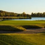 Panoramic view of a lush green golf course at The Quarry at Crystal Springs. Smooth