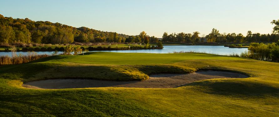 Panoramic view of a lush green golf course at The Quarry at Crystal Springs. Smooth