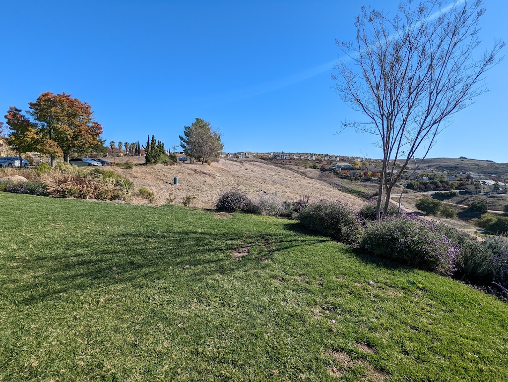 Panoramic view of a lush green golf course at The Ranch Golf Club. Smooth