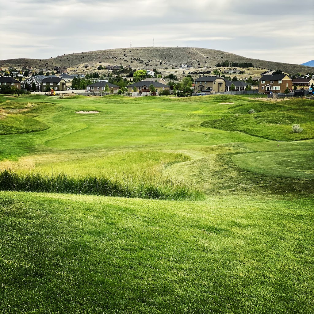 Panoramic view of a lush green golf course at The Ranches Golf Club. Smooth