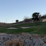 green grass with the flag in the hole.